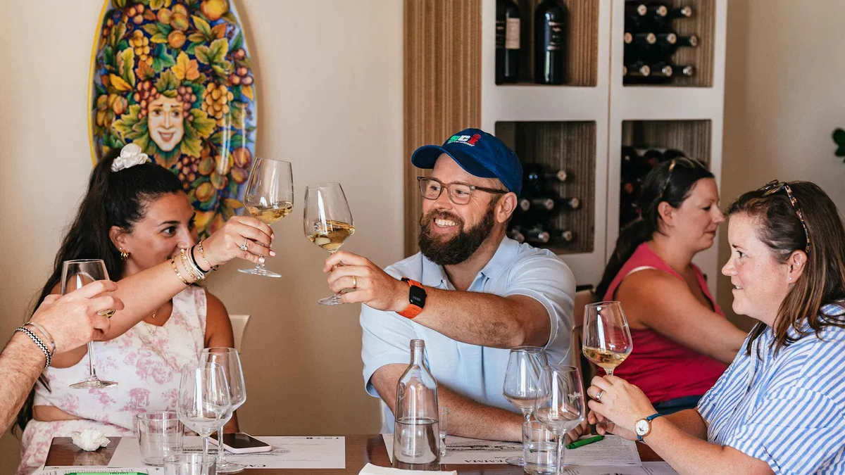 Small group tasting Sangiovese at a Chianti wine estate on a wine tasting tour from Florence